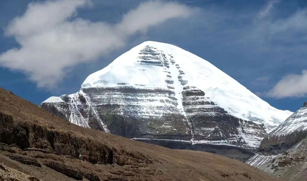 Scenic view of Mount Kailash surrounded by snow and clear skies during the Inner Kora tour.