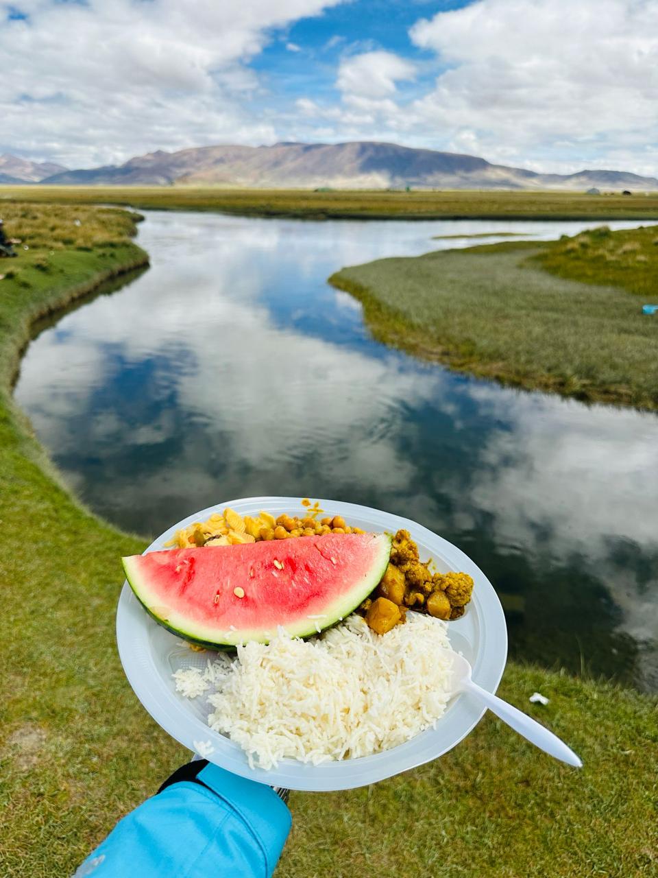 A vegetarian meal served during the Saga Dawa Festival, featuring rice, lentils, and vegetables