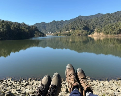 Trekkers Relaxing By The Lake