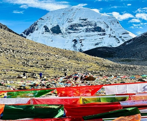 Pilgrims offering prayers and lighting butter lamps at a monastery near Mount Kailash